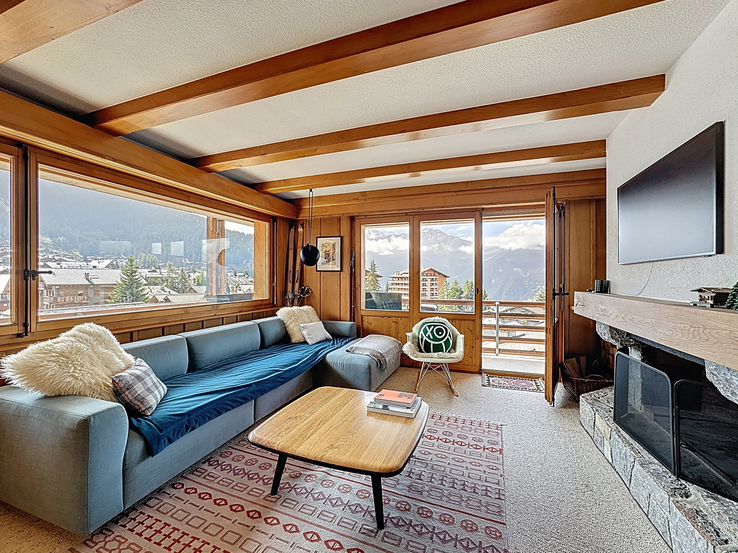 living room with fireplace and balcony access